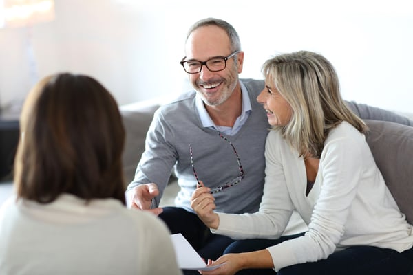 Senior couple meeting real estate agent for advice